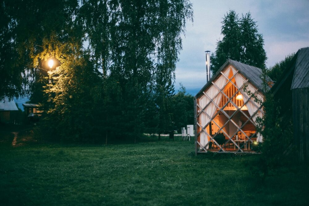 Tiny wooden house surrounded by greenery